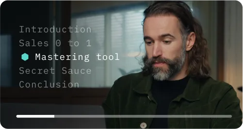 Man with long hair and beard looking at a laptop with text menu.